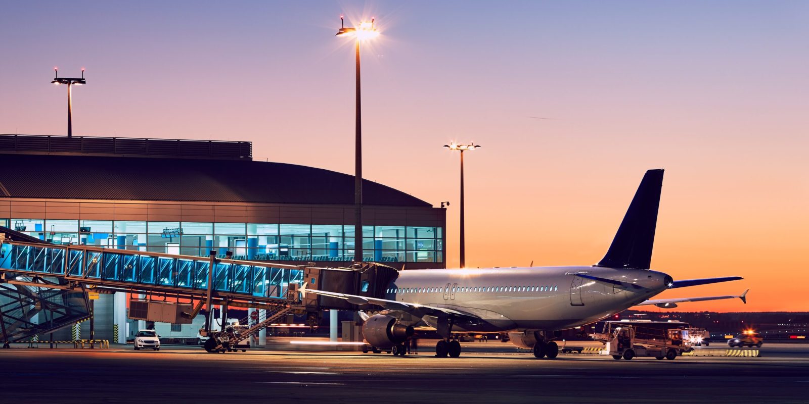 Preparation of the airplane before flight. Airport at the colorful sunset.
